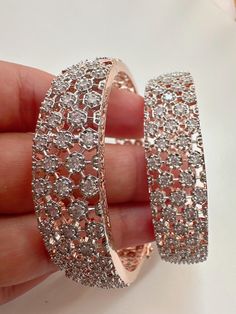 Rose gold  Finish American Diamond/CZ Bangles/Bracelet/Indian Party Wear Bangles/ CZ stone bangles/Indian wedding/bridal jewelry Plating-Rose gold  Opening :secures with a magnetic snap and hinge closure It is made by our artisans using expert techniques, so it sparkles and shines over the years. Best gift option for your loved ones comes in an exquisite gift box. Rose Gold Kada, Bridal Jewelry Diamond, Cz Bangles, Gold Kada, Bracelet Indian, Stone Bangles, Indian Bangles, Indian Party, Indian Party Wear