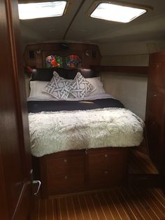 there is a bed in the cabin of a boat