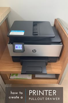 a printer sitting on top of a wooden shelf