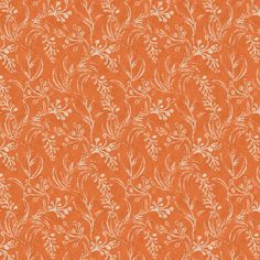 an orange wallpaper with white flowers and leaves on the side, as well as a pattern