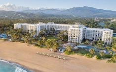 an aerial view of the resort and beach