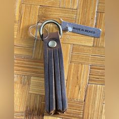 a leather keychain that has been made in mexico