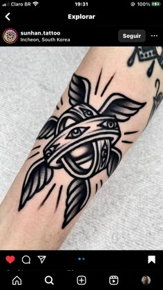 a black and white tattoo on the arm of a person with an eagle in it