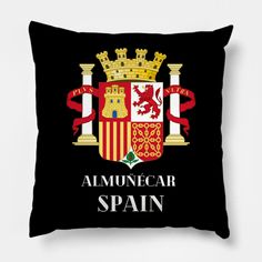 a black pillow with the spanish coat of arms on it