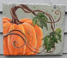 a painting of a pumpkin with vines and leaves painted on it's side,