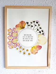 an art work with flowers and words on it