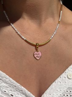 Looking for a unique and thoughtful gift for that special mother in your life? Look no further than this stunning handmade necklace featuring white freshwater pearls, shiny gold metal parts, and a beautiful heart charm made from pink enamel. Adorned with the word "Mama," this necklace is the perfect way to show your love and appreciation for the amazing mother in your life. Whether for Mother's Day, a birthday, or just because, this necklace is sure to become a treasured piece in any mother's je Pink Enamel, Freshwater Pearl Necklace, White Freshwater Pearl, Beautiful Heart, Freshwater Pearl Necklaces, Adjustable Necklace, Heart Beads, Handmade Necklace, Silver Turquoise