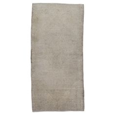 a beige rug on a white background with no one in it or someone out there