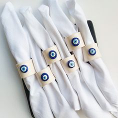 four napkins with evil eyes on them