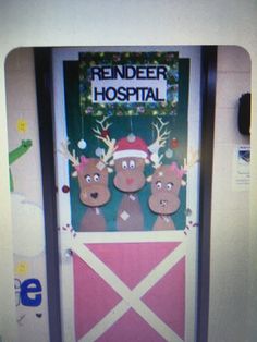 the door to reindeer hospital is decorated with farm animals and santa's helpers