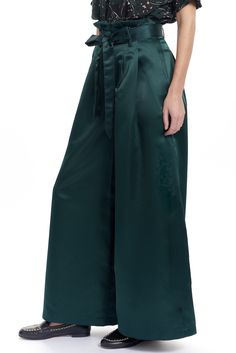 The Tony pant is a wide leg trouser with a paperbag style waist and a tie belt. There are welt back pockets and 2 side front pockets and belt loops. Shown in our exclusive Low shine satin. Content: 100% Poly Color: Pine Fits: Fitted at the waist then Relaxed Sizes: XS-L What we Love: Modern and dramatic trouser Limited Edition Made in Lovely Downtown Los Angeles Model is 5'9" size 2 and is wearing a size S Witchy Office Fashion, Emerald Pants, Wedding Lehengas Bridal, Lehenga South Indian, Sabyasachi Lehengas, Bridesmaid Lehengas, Blouse Crop Top, Blouse Crop, Lady Loki