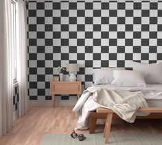 a bedroom with black and white checkered wallpaper