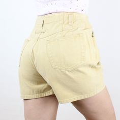 Item Description  These are so fun and unique! I love this brand, and the high rise and baggy-fit style is so fun and so classic early 90s! These are in a soft yellow color and are made of a 100% cotton rigid denim! They have belt loops that are set a bit lower than the waistband, front and back pockets, and a unique pleat design, where some of the pleats are actually in the pockets! These are meant to have a fun curvy/baggy fit (not at all slim) so definitely take a look at the measurements to Beige Cotton Y2k Style Bottoms, Y2k Bottoms With Built-in Shorts For Summer, Y2k Shorts With Pockets For Summer, Y2k Style Shorts With Pockets For Summer, Casual Jean Shorts For Spring, Y2k Style Summer Shorts With Pockets, Retro Cotton Bottoms With Built-in Shorts, 90s Inspired High Rise Bottoms With Pockets, 90s Inspired Wide Leg Cotton Bottoms