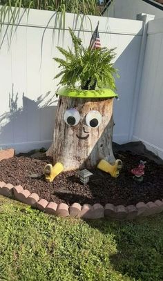 a tree stump with a face and eyes on it