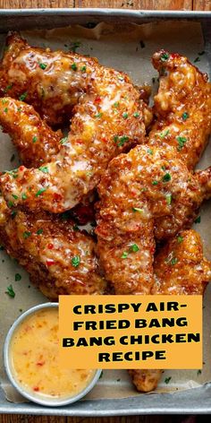 crispy air fried bang bang chicken recipe in a pan with dipping sauce on the side