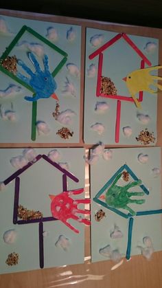 four handprinted houses with birds and clouds on them