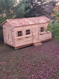 cedar shed with double door entry, single door entry and windows with window boxes Kayak Shed, Motorcycle Storage Shed, Canoe Storage, Cedar Shed, Wooden Storage Sheds, Storage Shed Kits, Diy Storage Shed, Boat Shed, Backyard Cottage