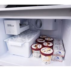 an open refrigerator filled with ice cream and yogurt