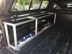 the back end of a truck with its cargo compartment open