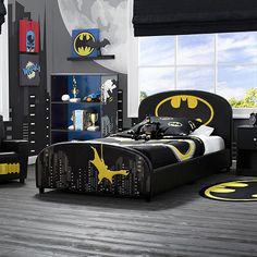 a batman themed bedroom with black and yellow decor