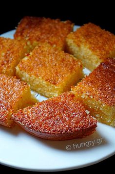 several pieces of cake on a white plate