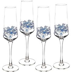 four wine glasses with blue designs on them