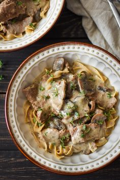 two plates of pasta with meat and mushrooms