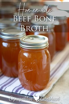 homemade beef bone broth in mason jars on a towel with text overlay that reads homemade beef bone broth