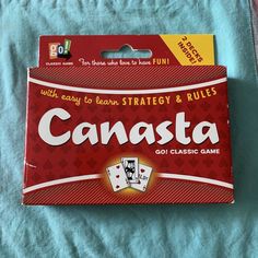 Get ready for hours of fun with the Go! Games Canasta Card Game. This game includes two sealed decks of cards and an instruction booklet, all brand new and never opened. The cards feature the Canasta design, a classic and beloved card game for all ages. Perfect for family game night or a fun gathering with friends, this set is sure to provide endless entertainment. Games For A Crowd, Canasta Card Game, Deck Sealing, Go Game, Gathering With Friends, Instructions Booklet, Hobby Games, Family Game, Family Game Night