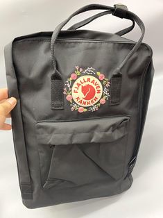 "Welcome to my store and choose the perfect hand-embroidered fjallraven kanken backpack   Version & Size + Medium size: 38x27x13cm  + Big size: 42x32x13cm  - Product price includes: hand-embroidered fjallraven kanken backpack and design as shown in the picture - I can make fjallraven kanken backpack hand embroidery patterns according to your ideas - fjallraven kanken backpack will be hand embroidered with thread that won't fade when washed - fjallraven kanken backpack has a small front compartme Casual Embroidered Backpack, Kanken Classic, Rose Embroidery Designs, Backpack Fjallraven, Custom Backpack, Personalized Embroidery, Rose Embroidery, Embroidered Bag, Classic Backpack