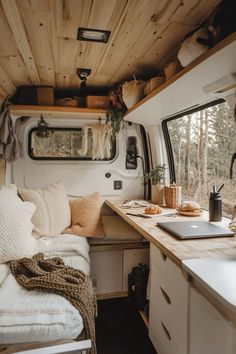 the interior of a camper with wood paneling