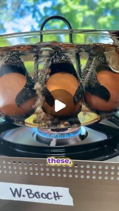 three eggs are sitting in an egg cooker on a stove top with the words, what does it mean?