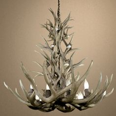 a chandelier made out of antler branches