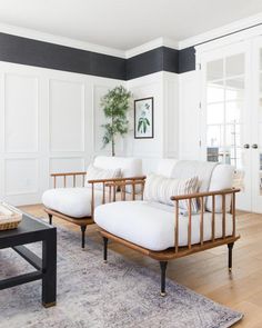 a living room filled with furniture and a rug