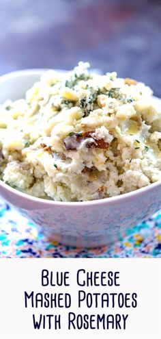 blue cheese mashed potatoes with rosemary in a white bowl on a colorful tablecloth