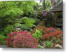 the garden is full of colorful flowers and trees