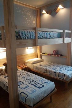 two bunk beds in a room with wooden floors