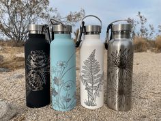 four different styles of water bottles sitting on the ground