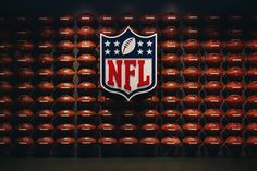 the nfl logo on a wall made out of football balls stock images and royalty photos