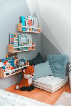 a small child's room with bookshelves and toys