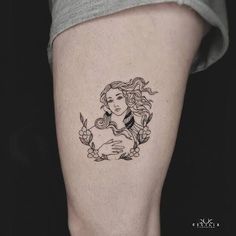 a woman's leg with a tattoo on it