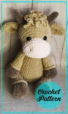 a crocheted stuffed animal sitting on top of a wooden floor with the words crochet pattern below it