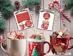 two coffee mugs filled with holiday treats and candy