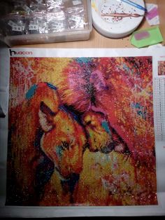 an image of two dogs painted on a piece of paper with paintbrushes next to it