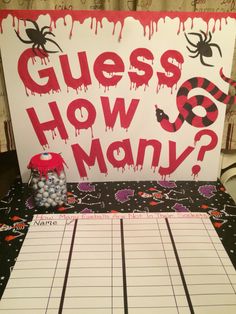 a game board with the words guess how many? on it and a spider theme