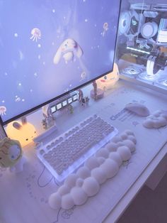 a desk with a computer, keyboard and mouse on it