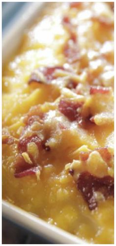 a casserole dish with bacon and cheese in it