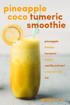 an orange smoothie in a tall glass with a straw garnish on top