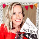 a woman holding up a sign with the word school written on it in front of her