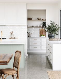 the kitchen is clean and ready to be used as a dining room or office space